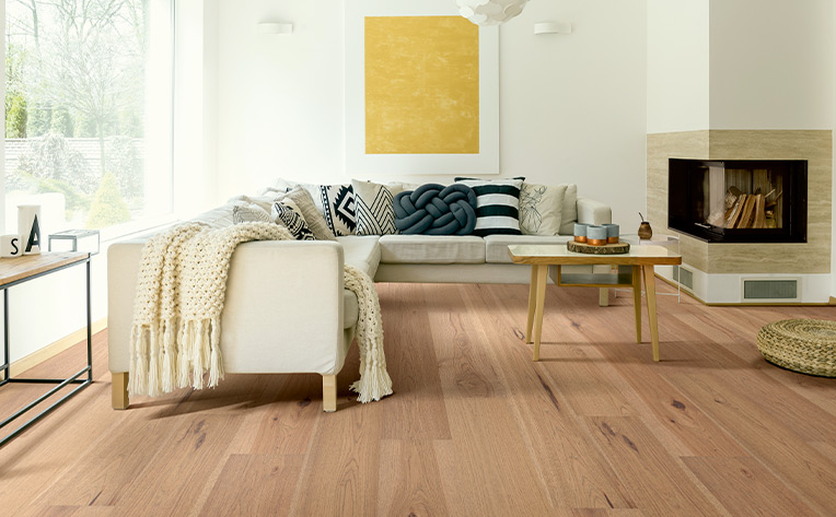 warm toned hardwood flooring in cozy living room